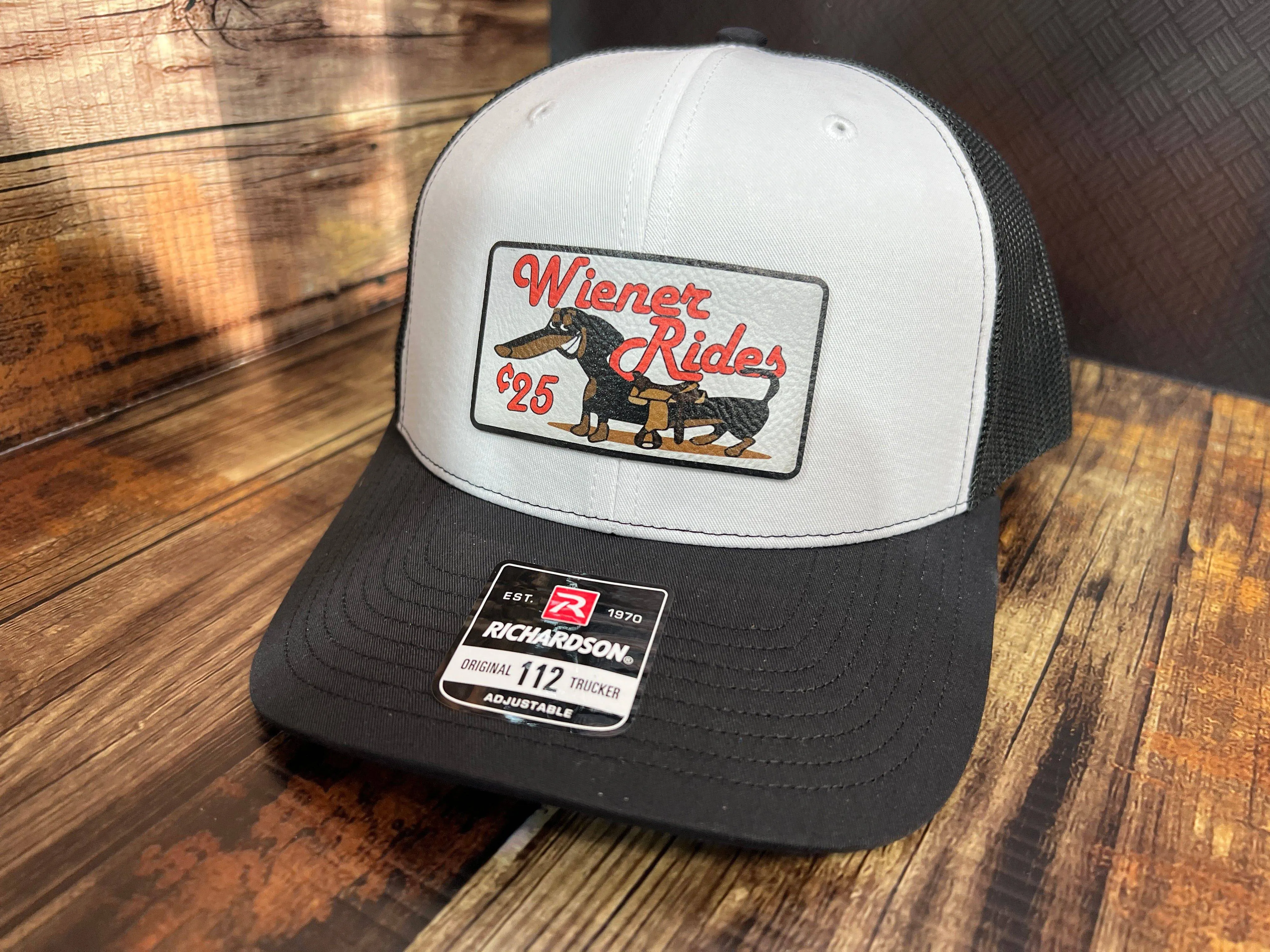 Wiener Rides Patch Hat with a UV Printed Premium Leatherette Patch on a Richardson 112 Trucker Hat